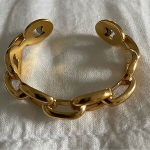 Henri Bendel gold tone cuff bangle.